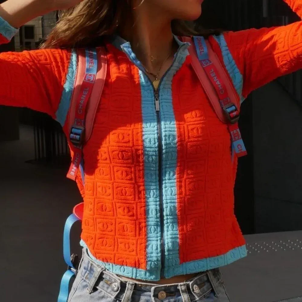 Rihanna in Rare Vintage CHANEL CC Logo Cropped Long Sleeve Sweater Jacke…